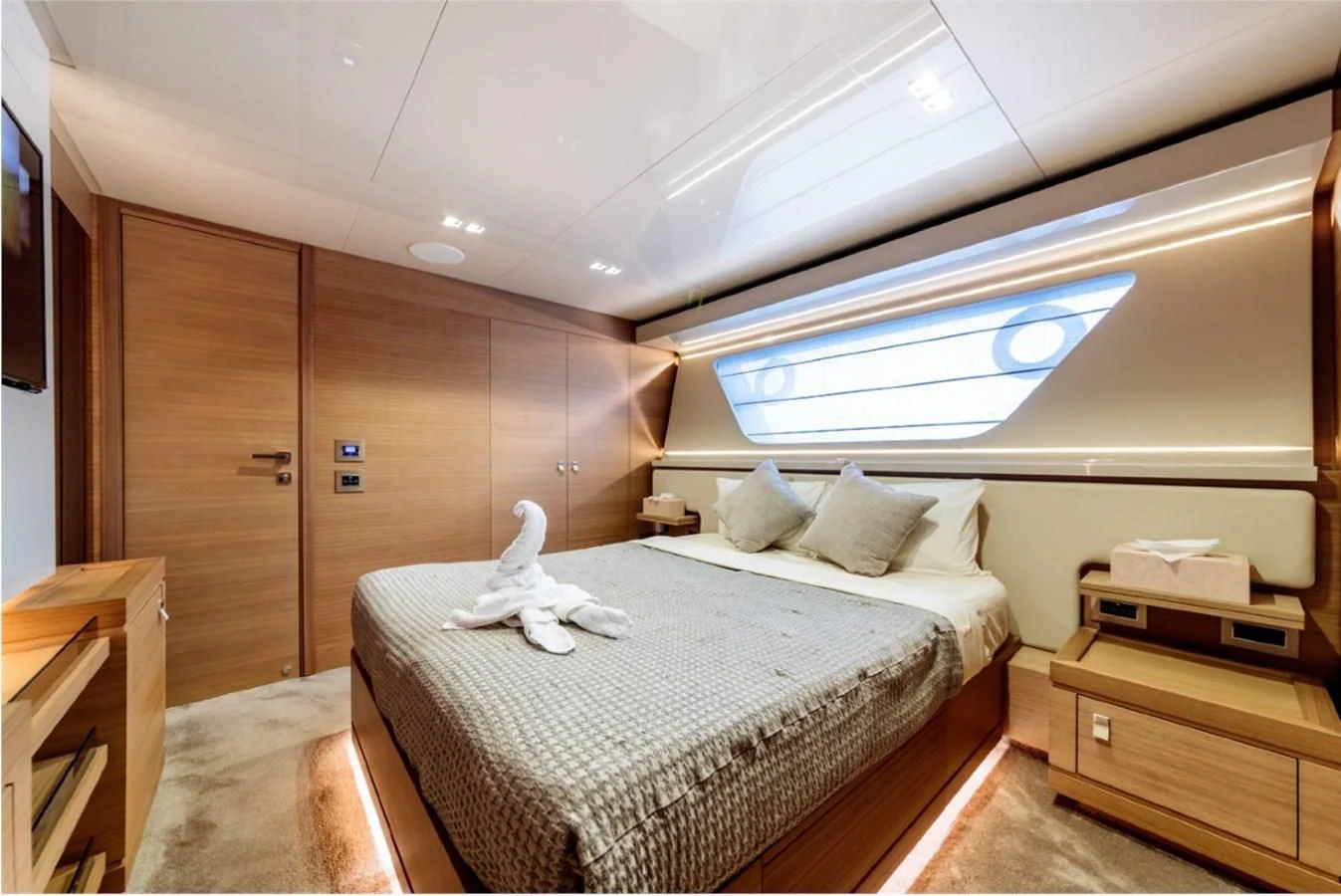 a room with a bed and a window aboard SEVEN Yacht for Sale