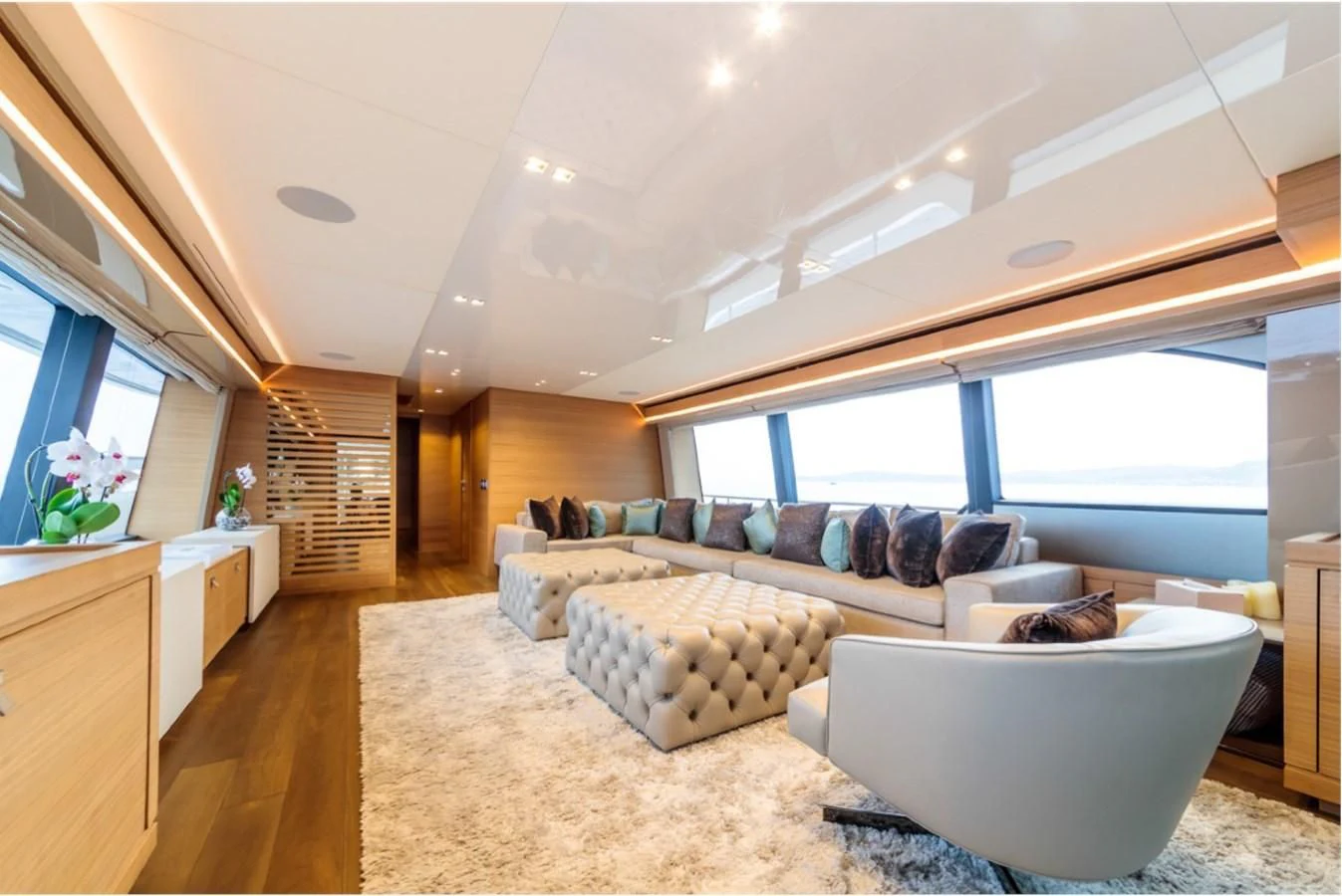 a living room with a large window aboard SEVEN Yacht for Sale