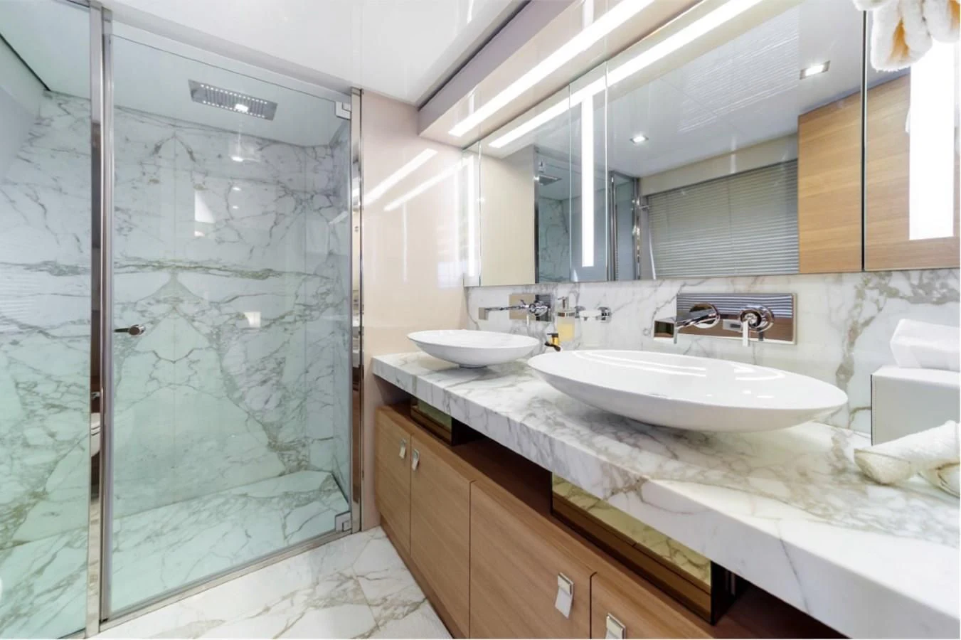 a bathroom with a glass shower aboard SEVEN Yacht for Sale