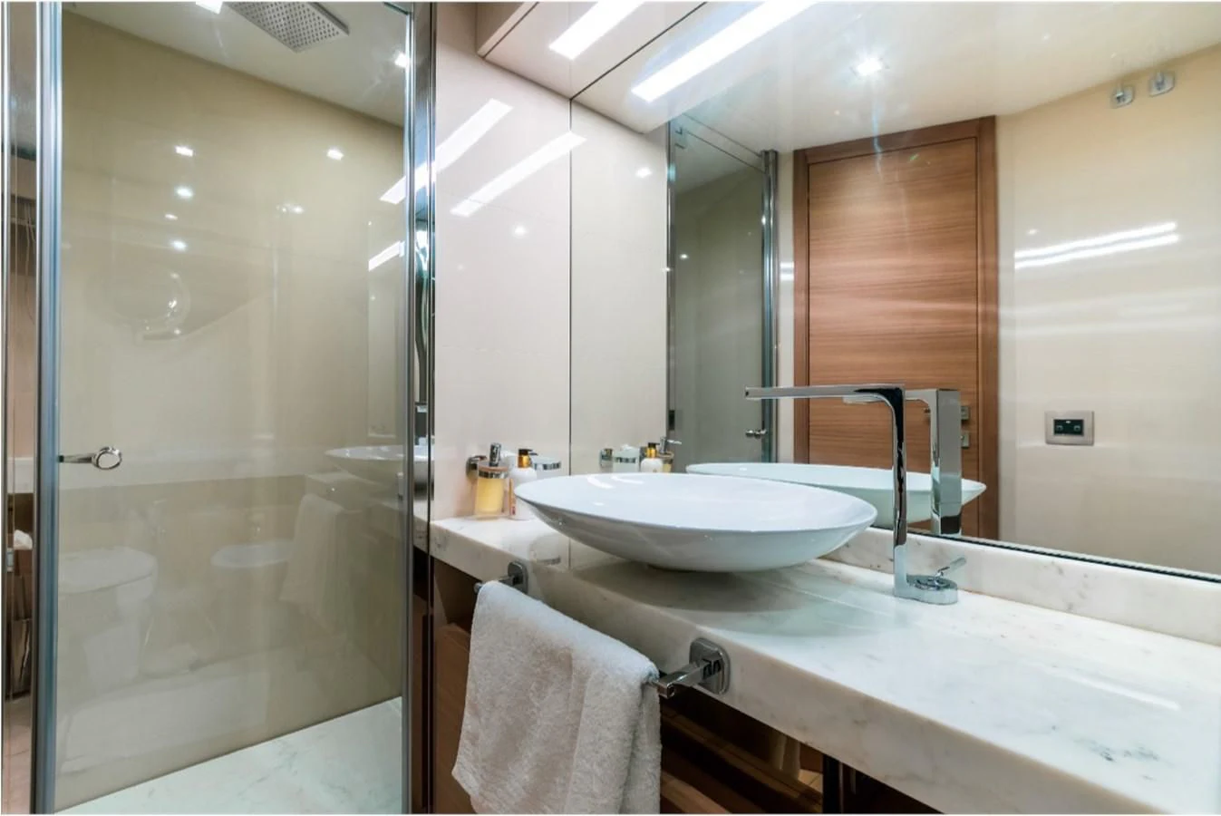 a bathroom with a large mirror aboard SEVEN Yacht for Sale