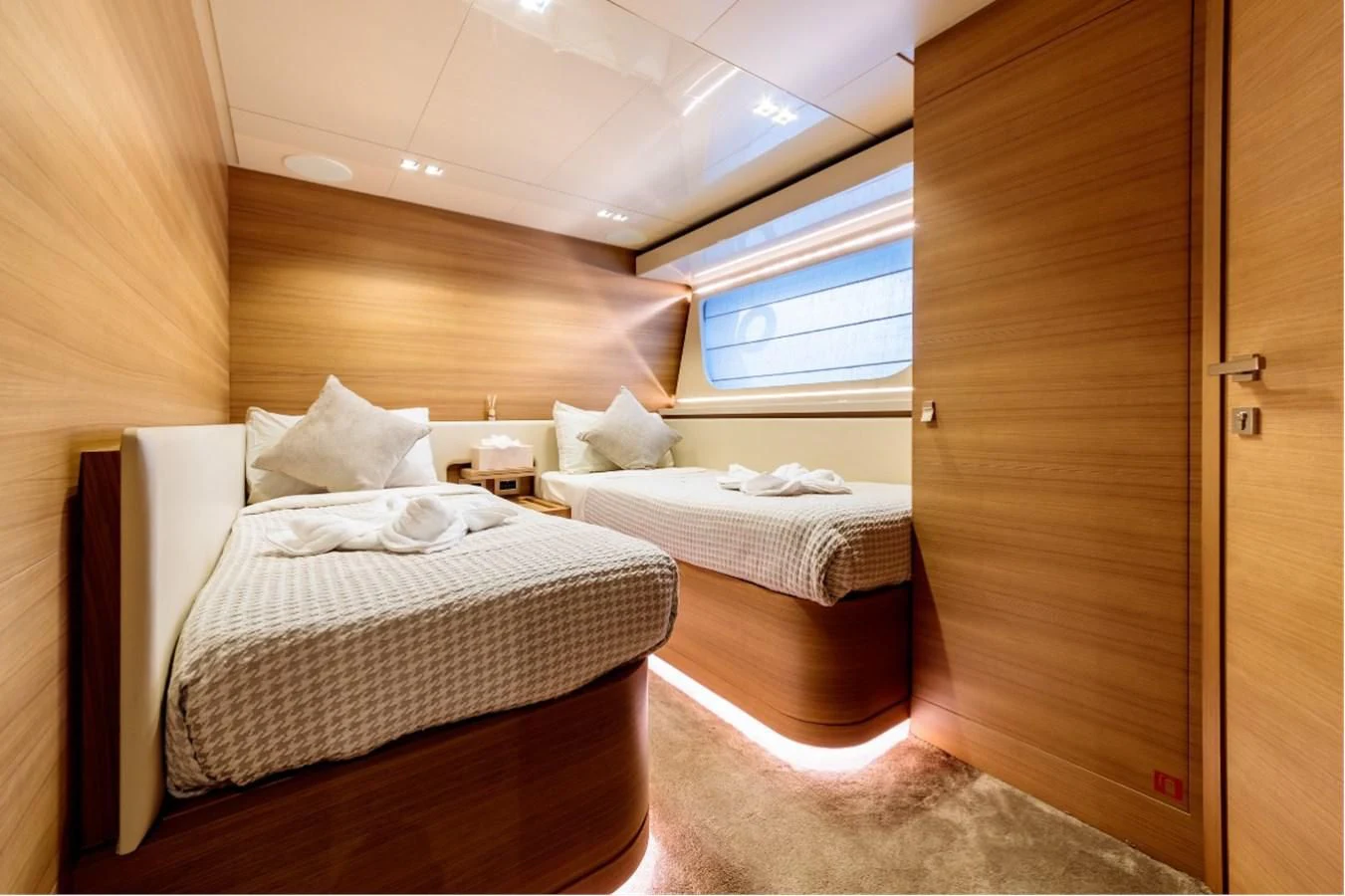 a room with two beds aboard SEVEN Yacht for Sale