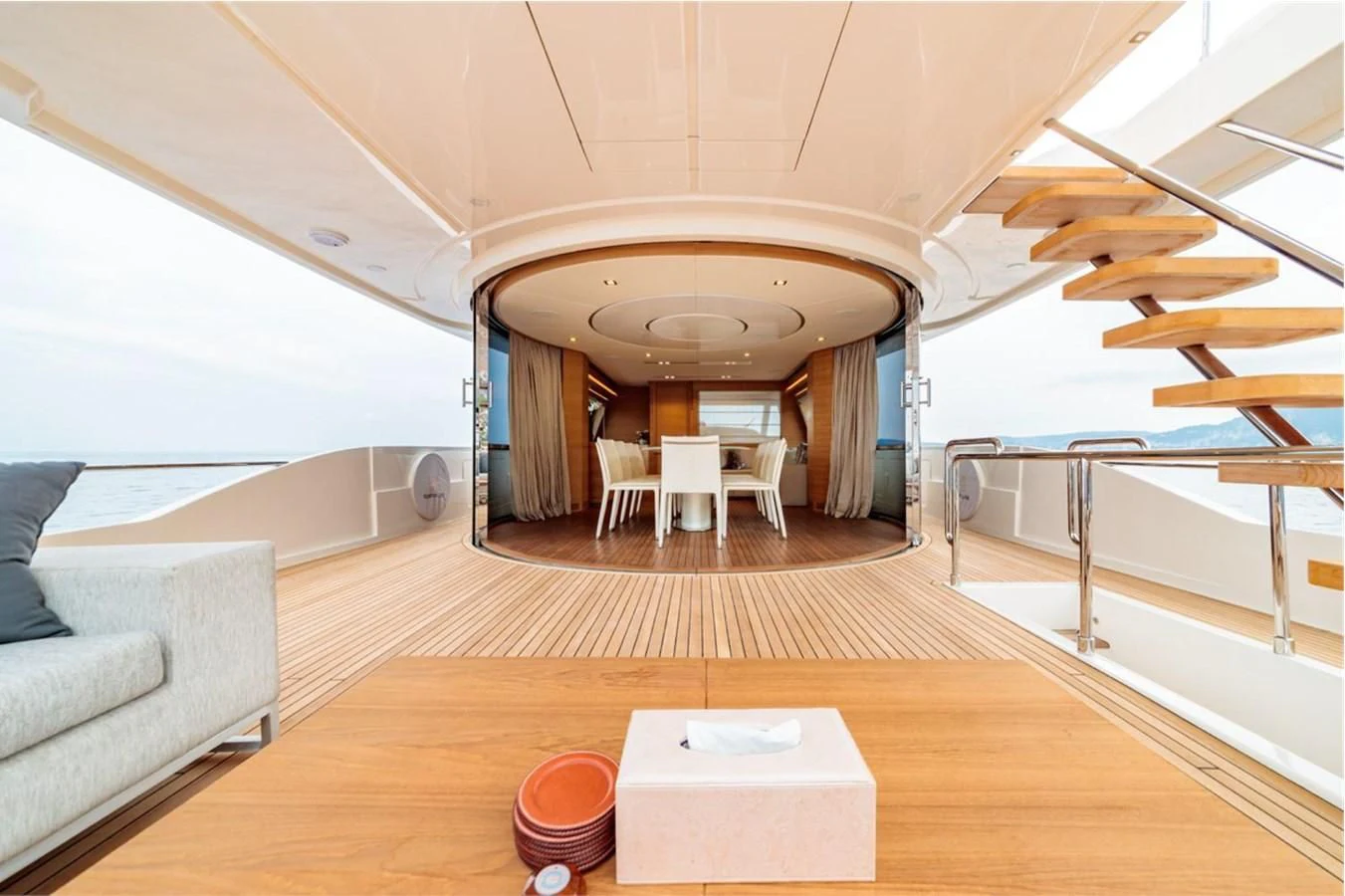 a room with a couch and a table and chairs aboard SEVEN Yacht for Sale