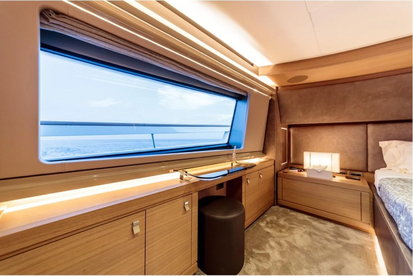 a room with a bed and a window aboard SEVEN Yacht for Sale