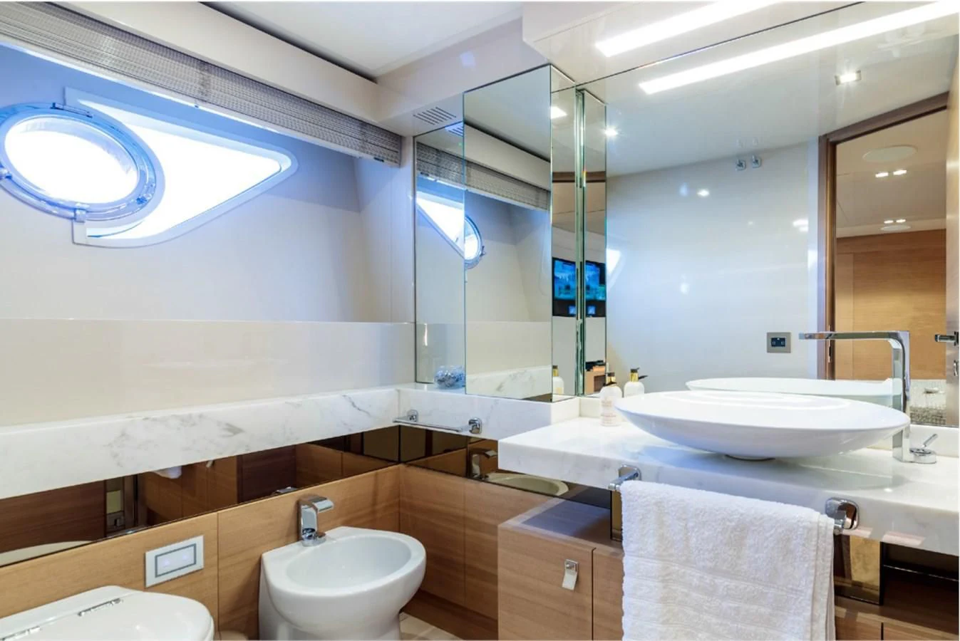 a bathroom with a large mirror aboard SEVEN Yacht for Sale