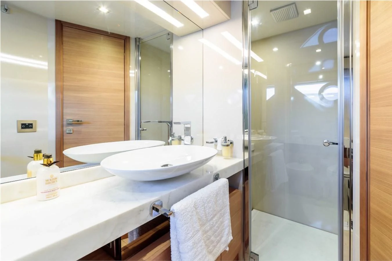 a bathroom with a large mirror aboard SEVEN Yacht for Sale