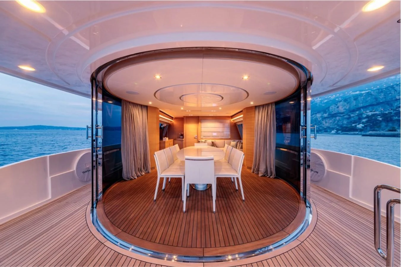 a large room with a table and chairs aboard SEVEN Yacht for Sale