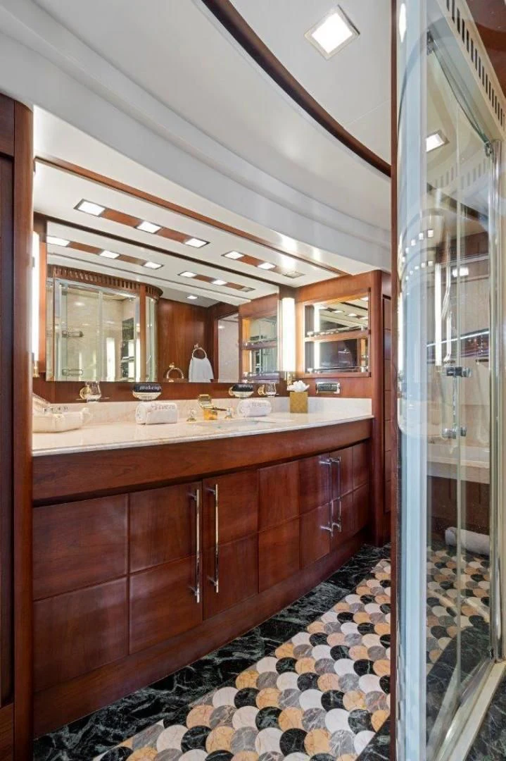 a bathroom with a large mirror aboard VIVERE Yacht for Sale