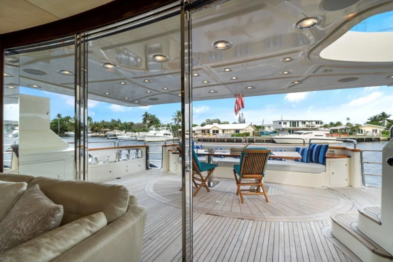 a room with a view of the water and a beach aboard VIVERE Yacht for Sale