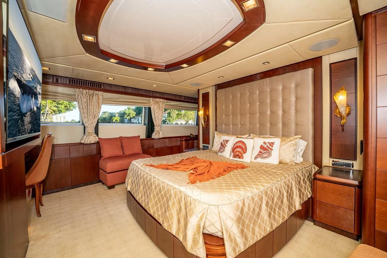 a bedroom with a bed and a couch aboard VIVERE Yacht for Sale