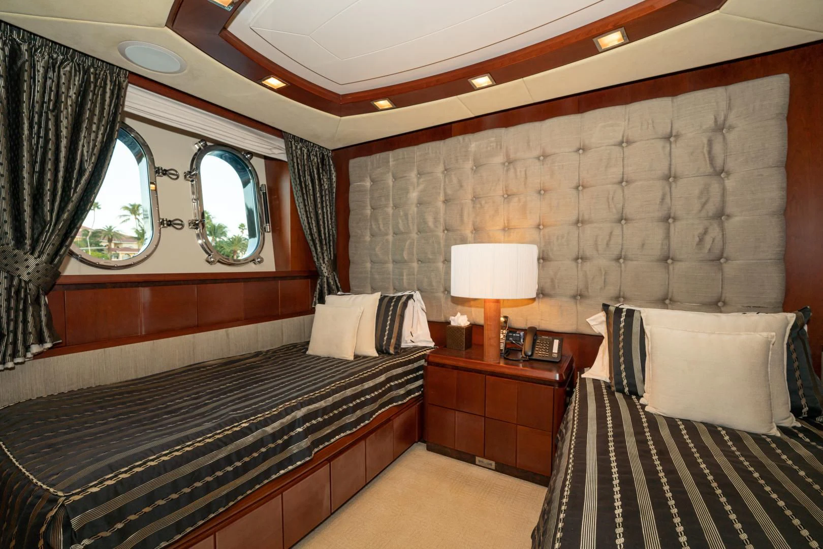 a room with a bed and a window aboard VIVERE Yacht for Sale