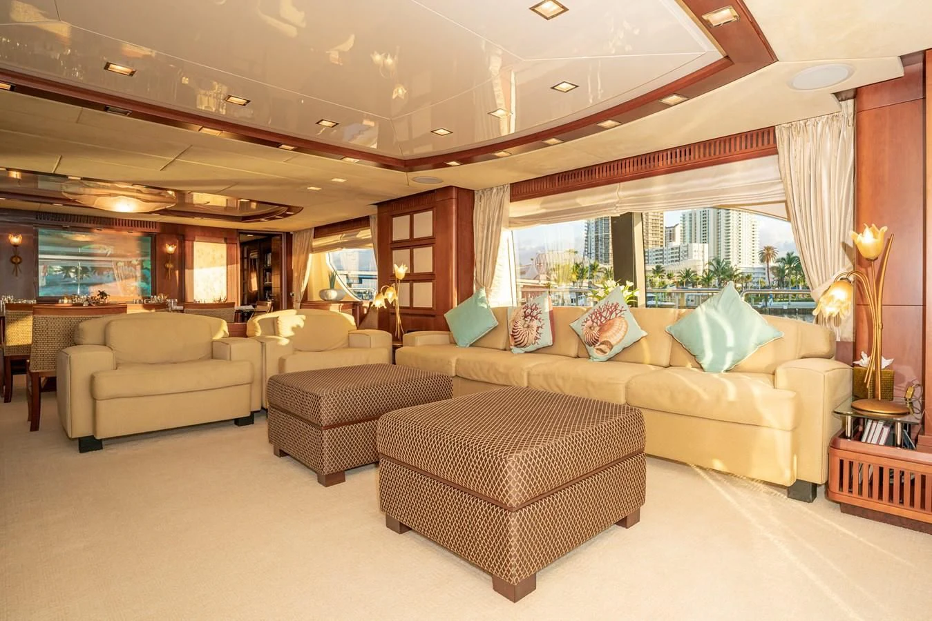 a living room with couches and a large window aboard VIVERE Yacht for Sale