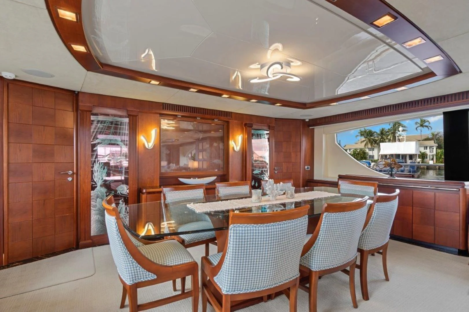 a restaurant with tables and chairs aboard VIVERE Yacht for Sale