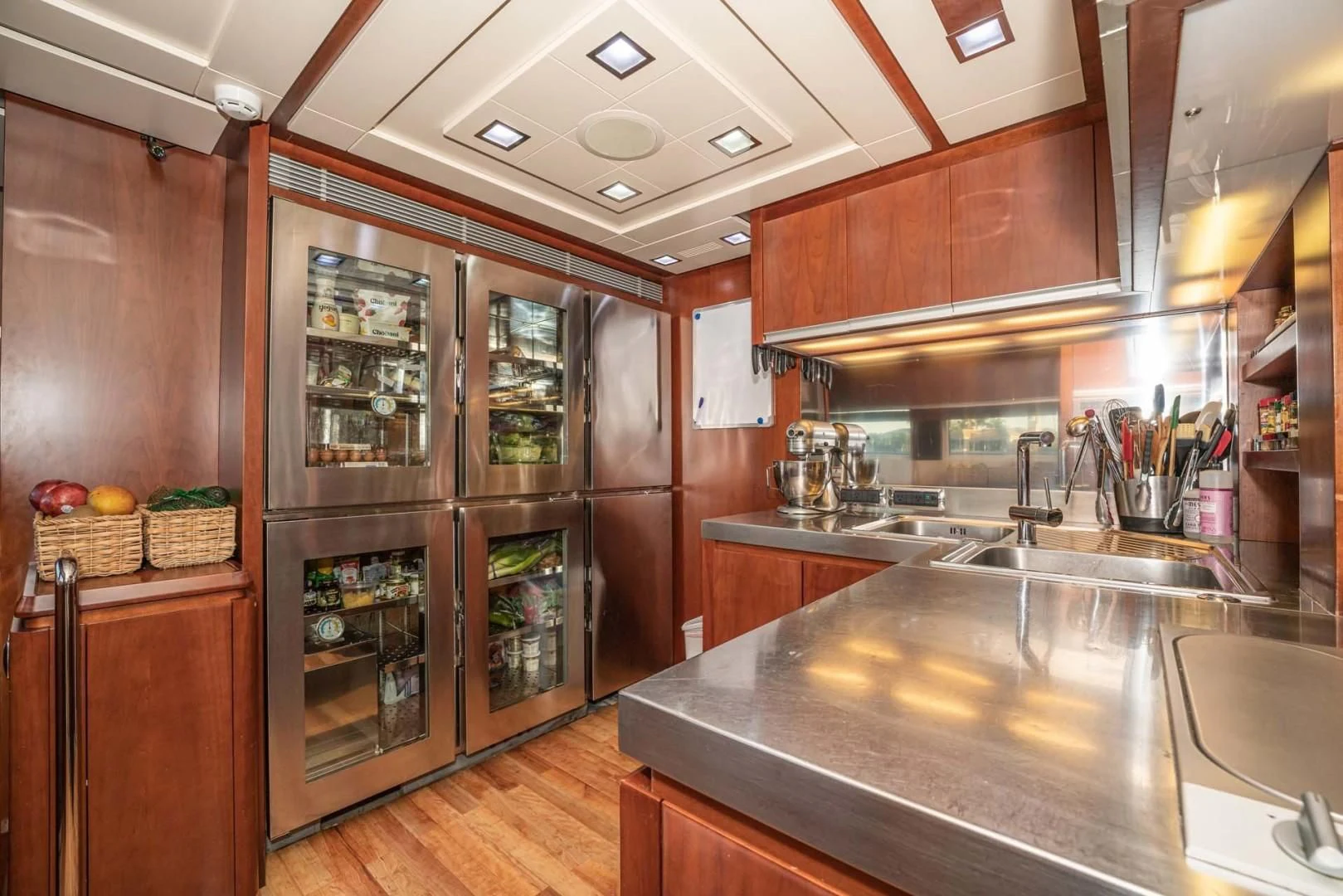 a kitchen with a glass wall aboard VIVERE Yacht for Sale