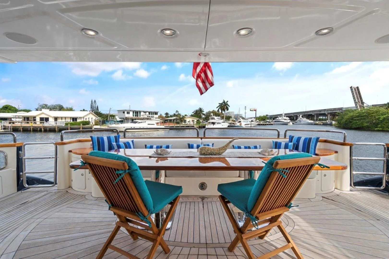 a deck with chairs and a pool aboard VIVERE Yacht for Sale