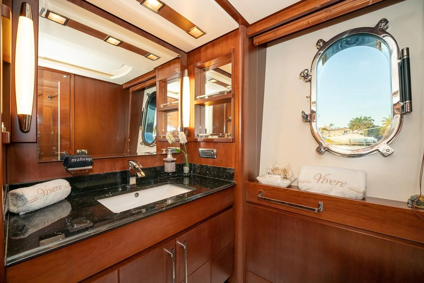 a bathroom with a large mirror aboard VIVERE Yacht for Sale