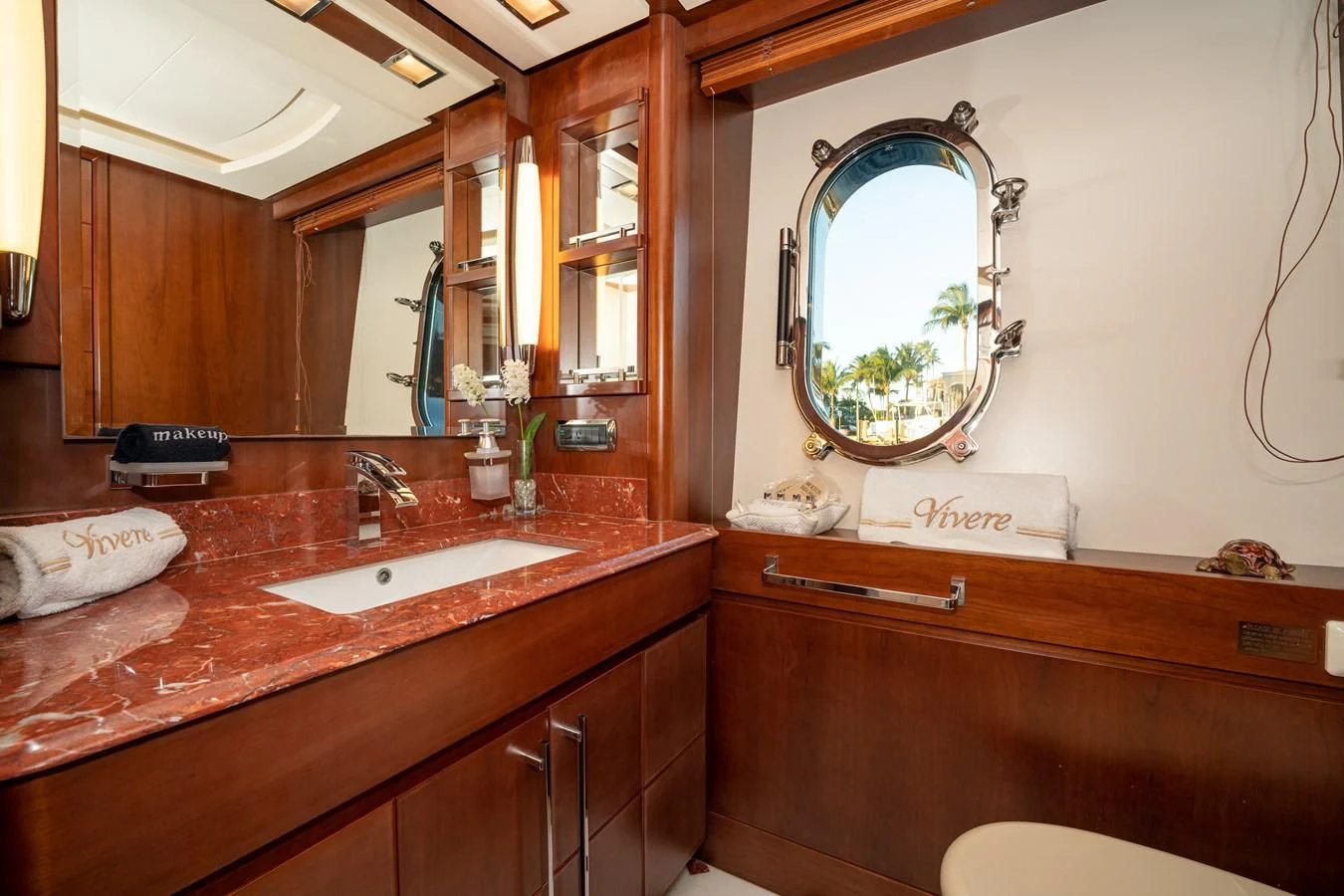a bathroom with a large mirror aboard VIVERE Yacht for Sale