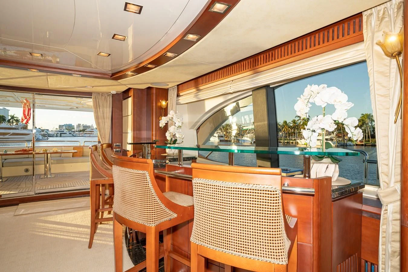 a room with a view of the water and the pool aboard VIVERE Yacht for Sale
