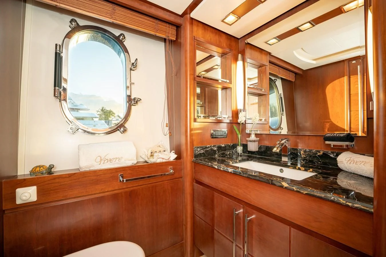 a bathroom with a large mirror aboard VIVERE Yacht for Sale