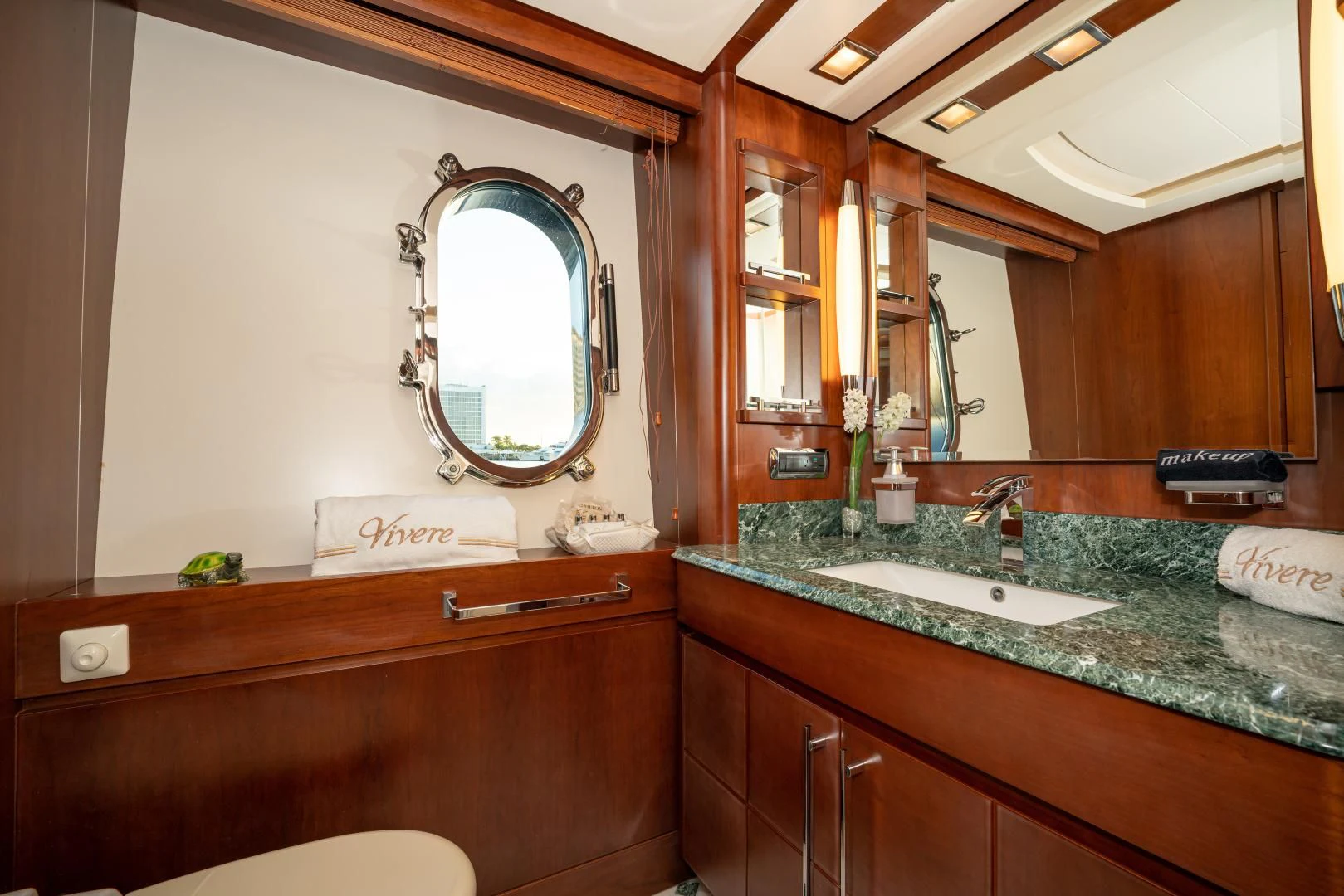 a bathroom with a large mirror aboard VIVERE Yacht for Sale