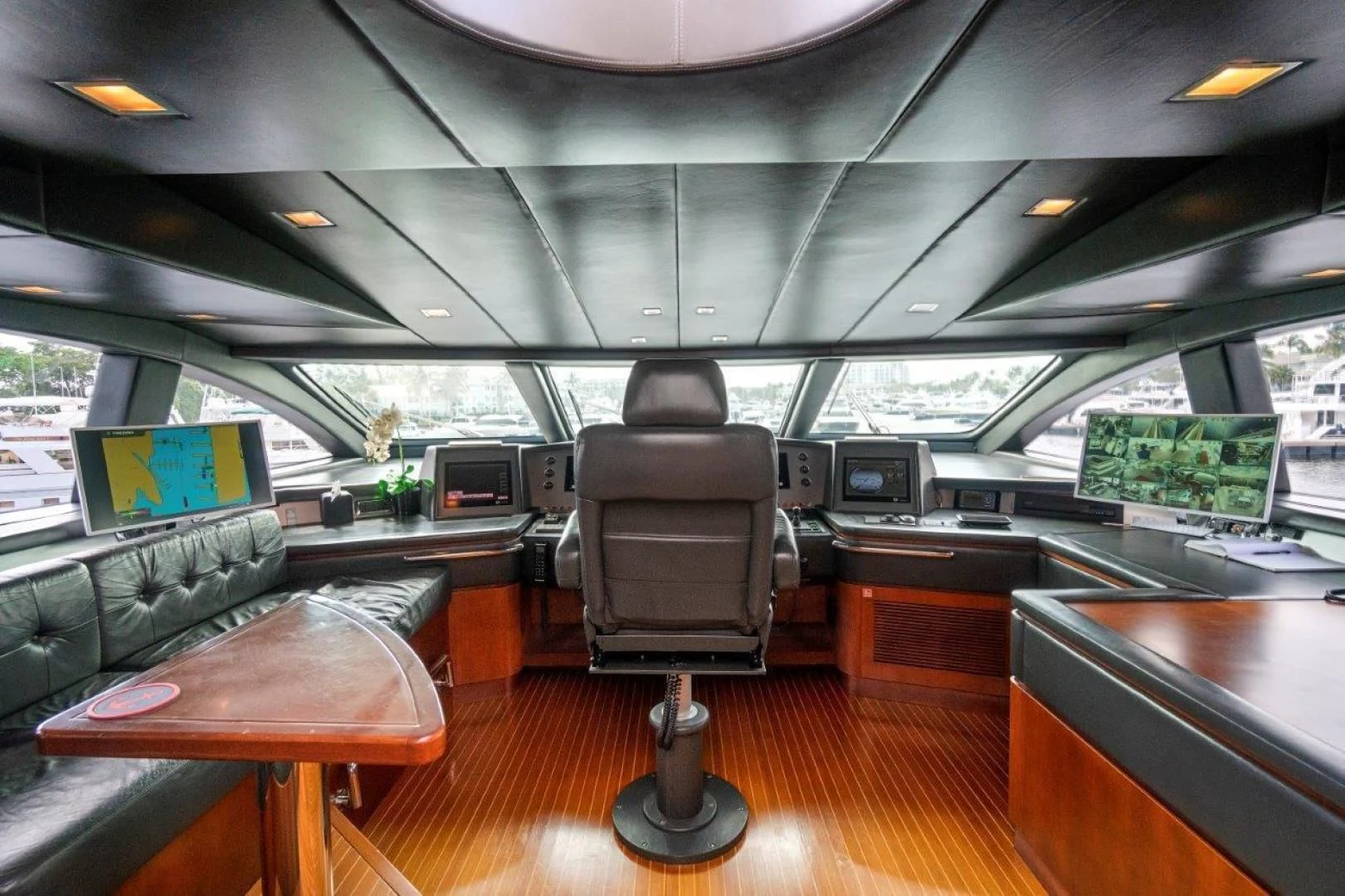 a room with a table and chairs aboard VIVERE Yacht for Sale