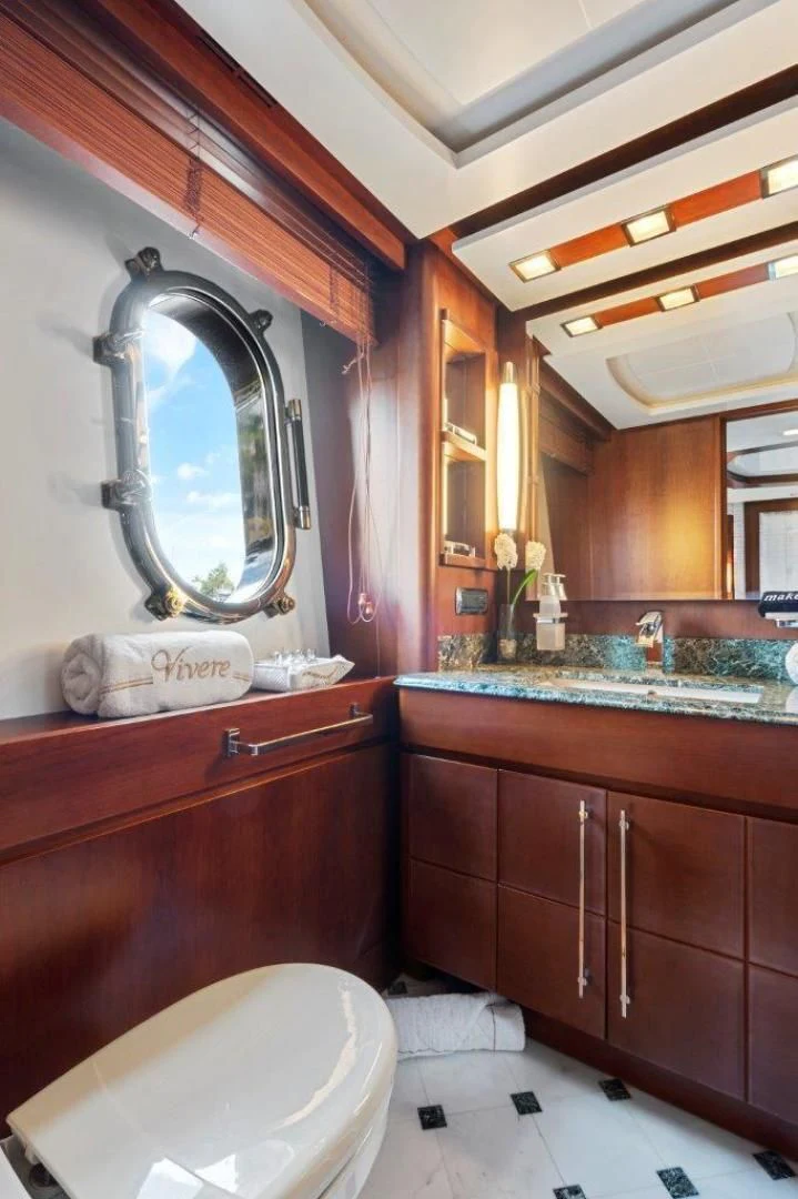 a bathroom with a large mirror aboard VIVERE Yacht for Sale