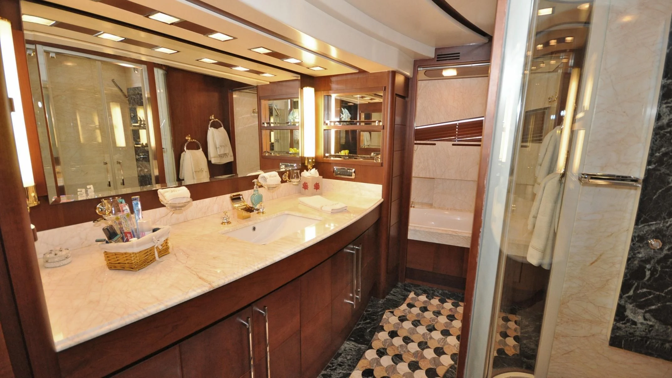a bathroom with a countertop sink and a shower unit aboard VIVERE Yacht for Sale