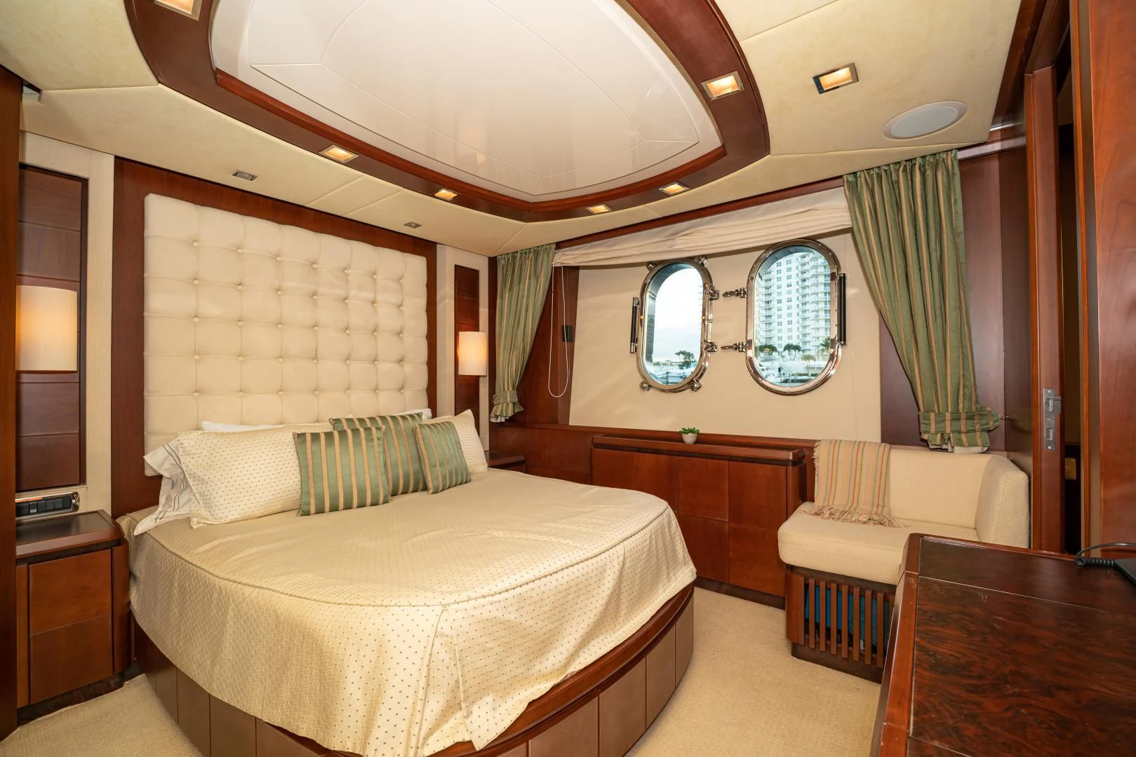 a room with a bed and a window aboard VIVERE Yacht for Sale