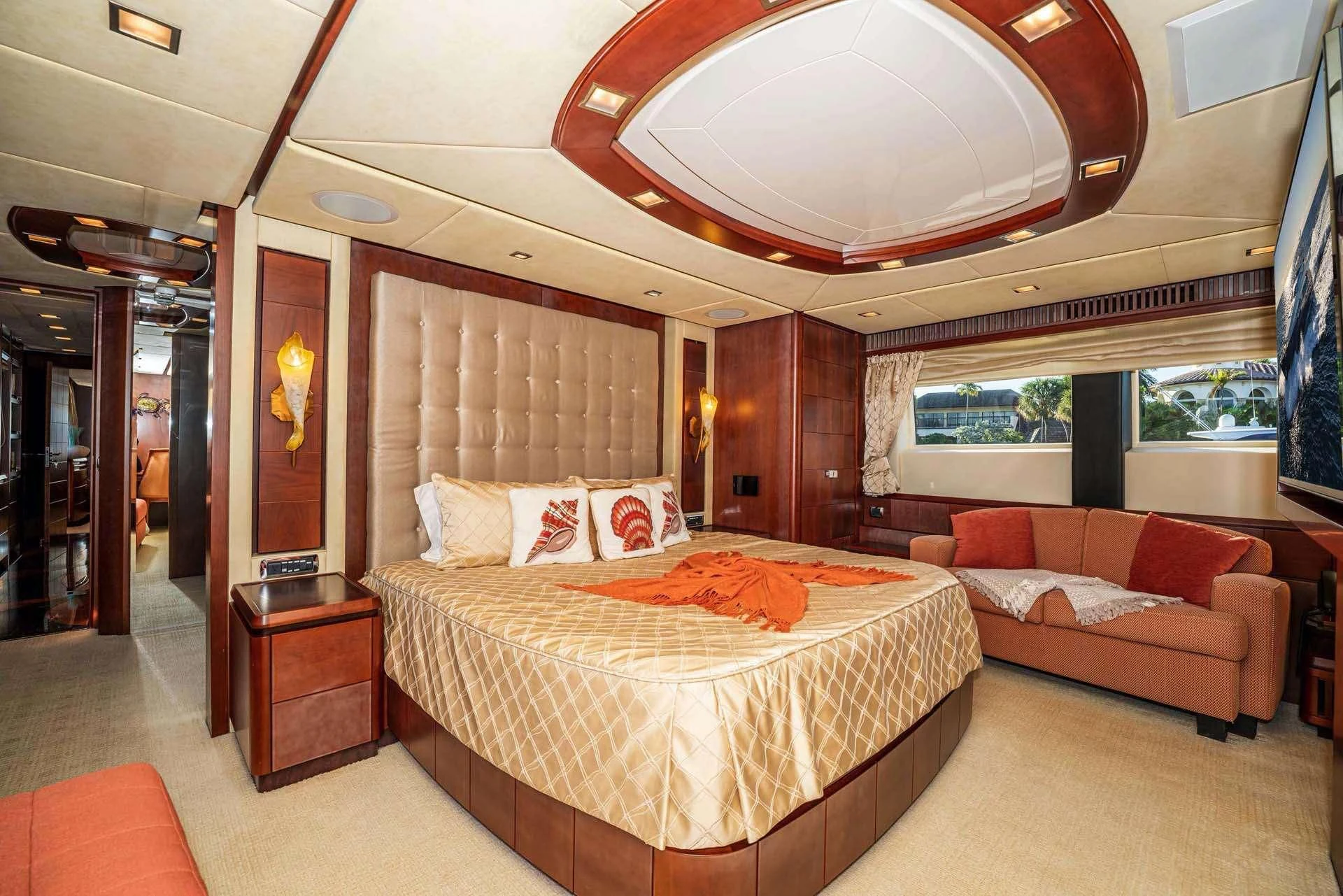 a room with a bed and a couch aboard VIVERE Yacht for Sale