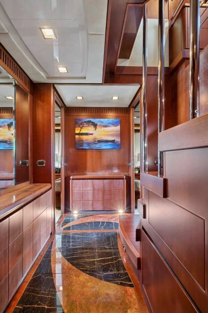 a hallway with wood cabinets aboard VIVERE Yacht for Sale
