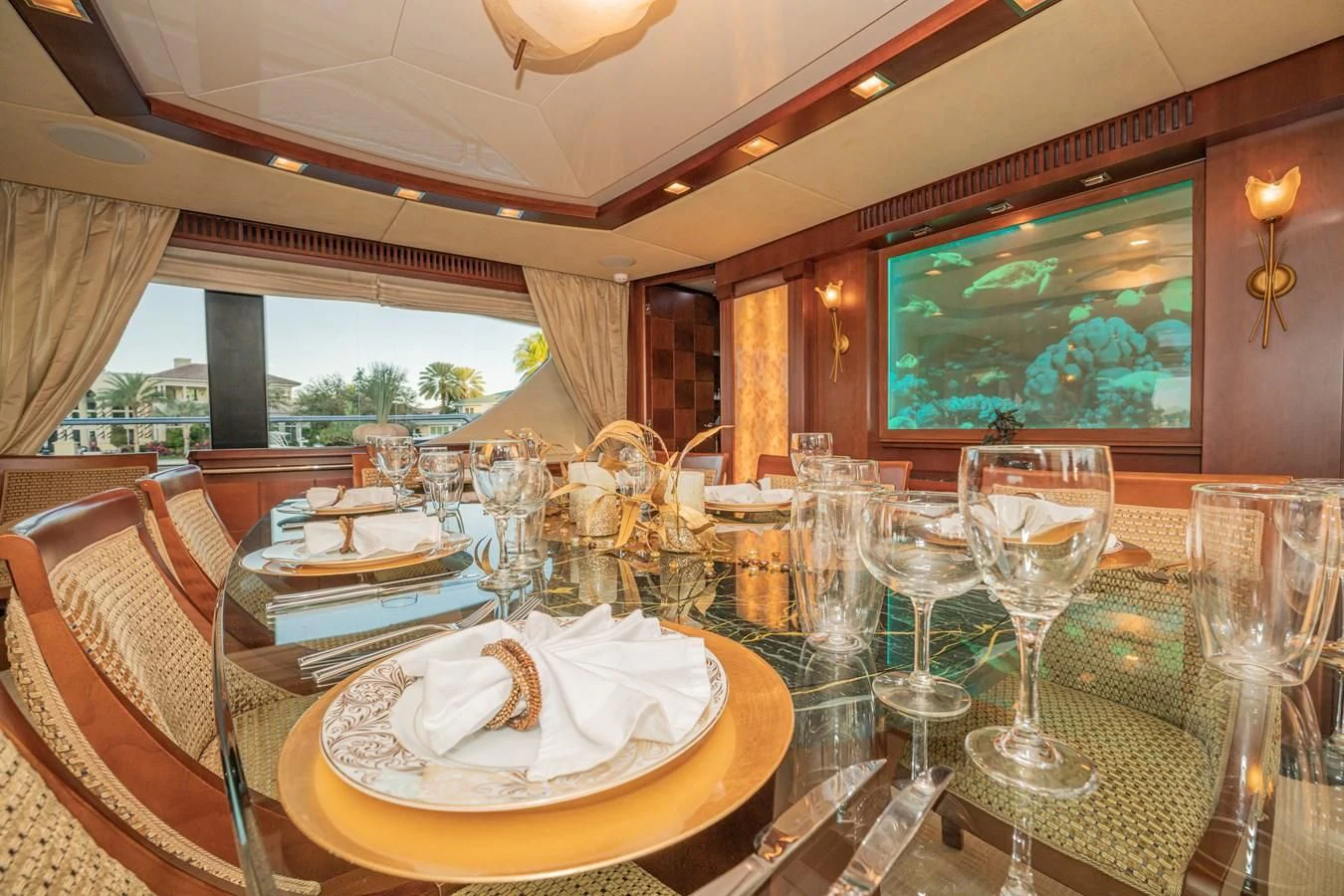a table set for a dinner party aboard VIVERE Yacht for Sale