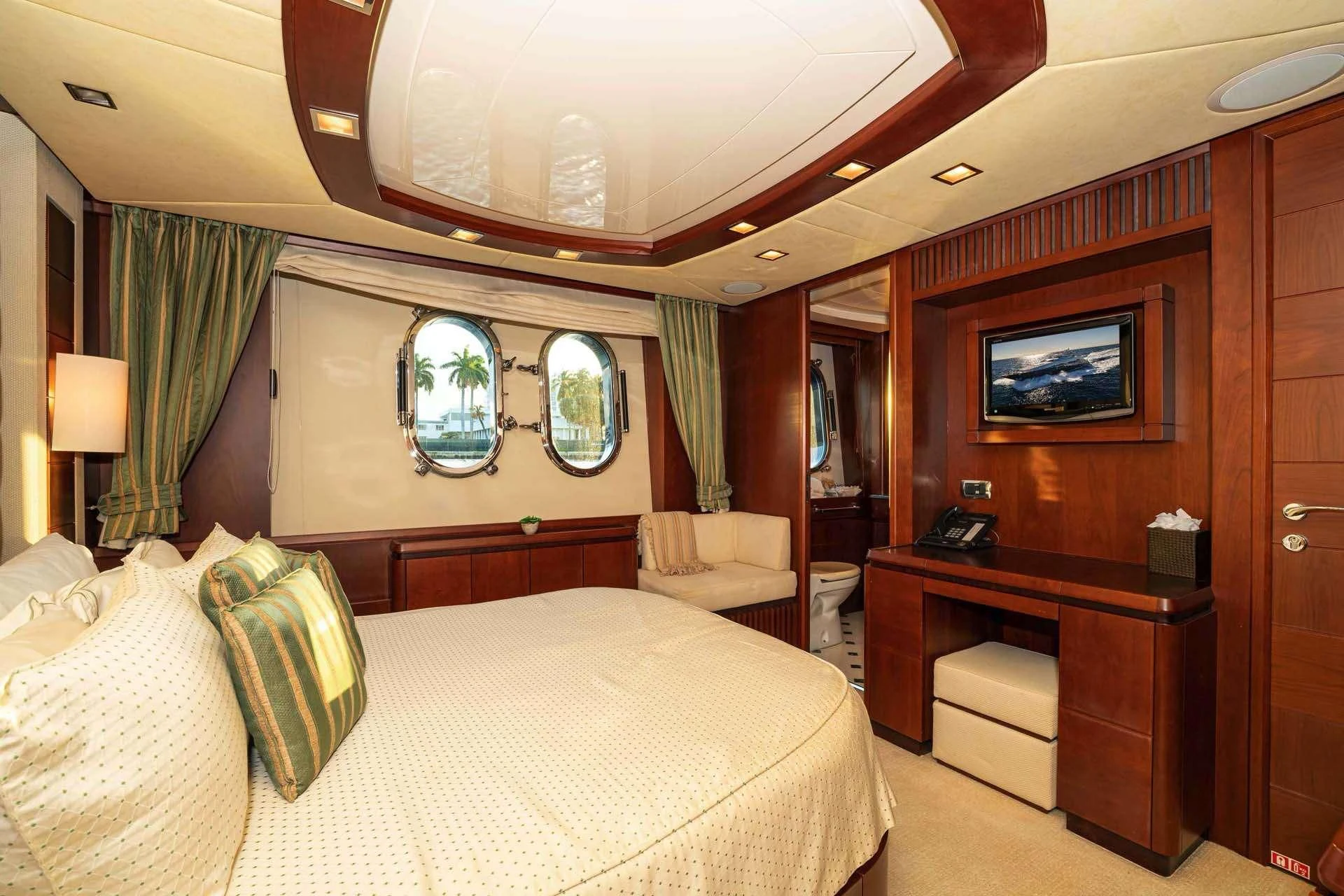 a hotel room with a bed and a tv aboard VIVERE Yacht for Sale