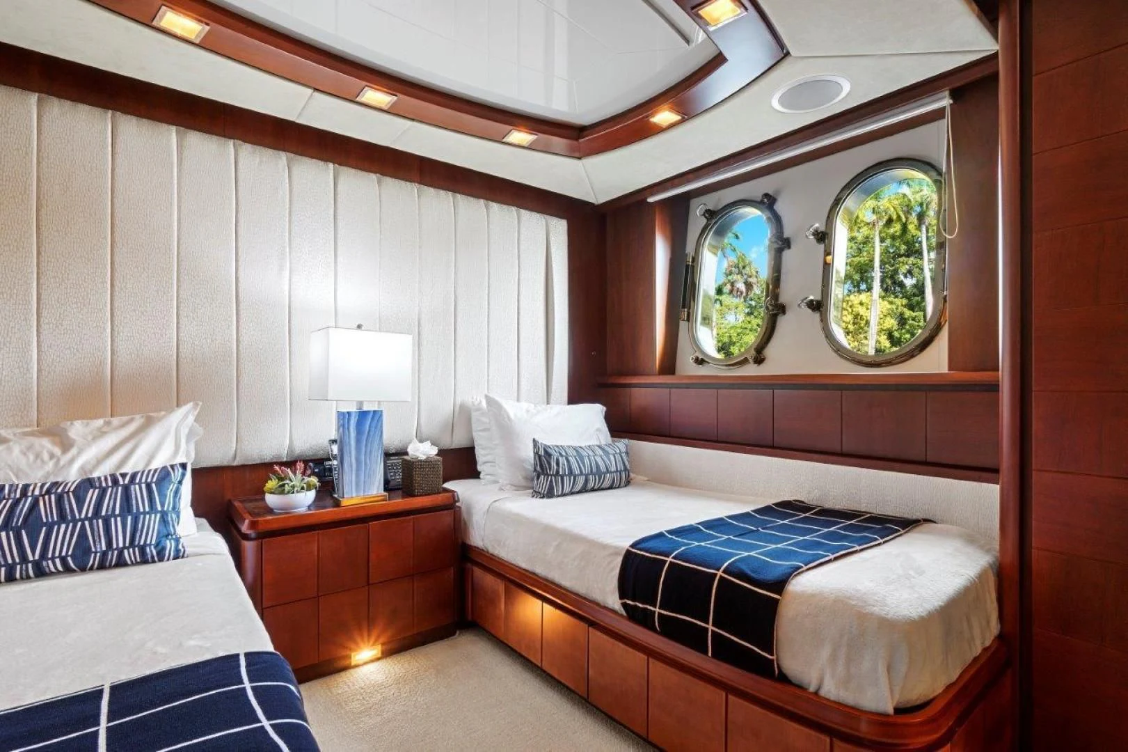 a room with a bed and a window aboard VIVERE Yacht for Sale