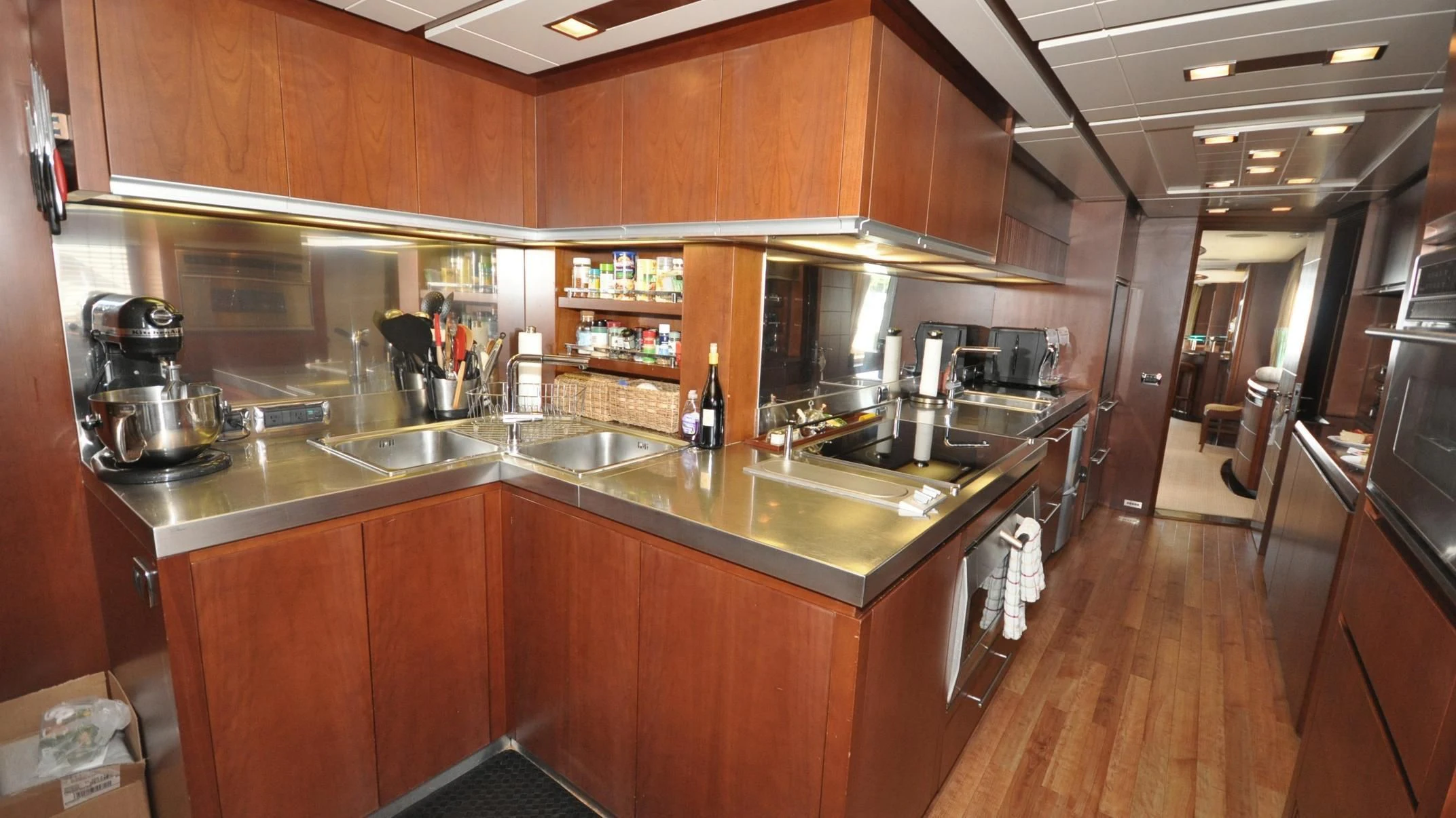 a kitchen with wooden cabinets aboard VIVERE Yacht for Sale