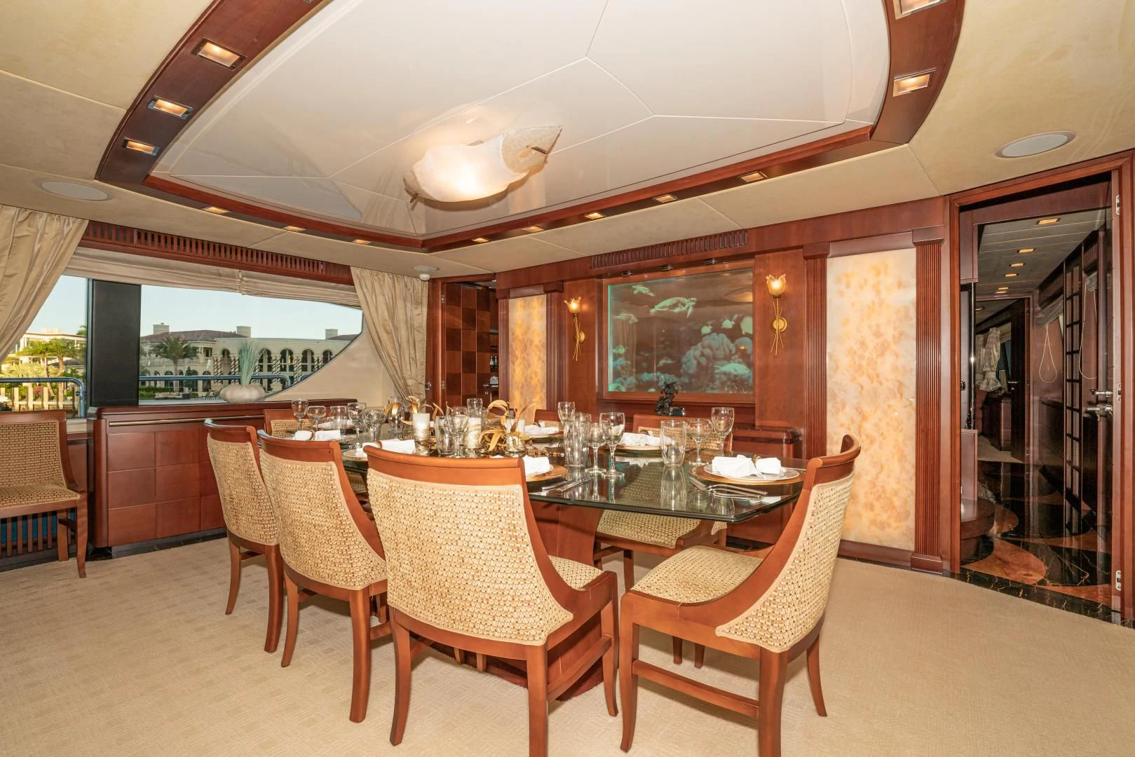 a dining room with a table and chairs aboard VIVERE Yacht for Sale