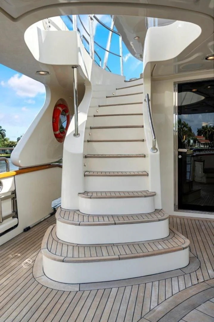 a white staircase with a red light aboard VIVERE Yacht for Sale