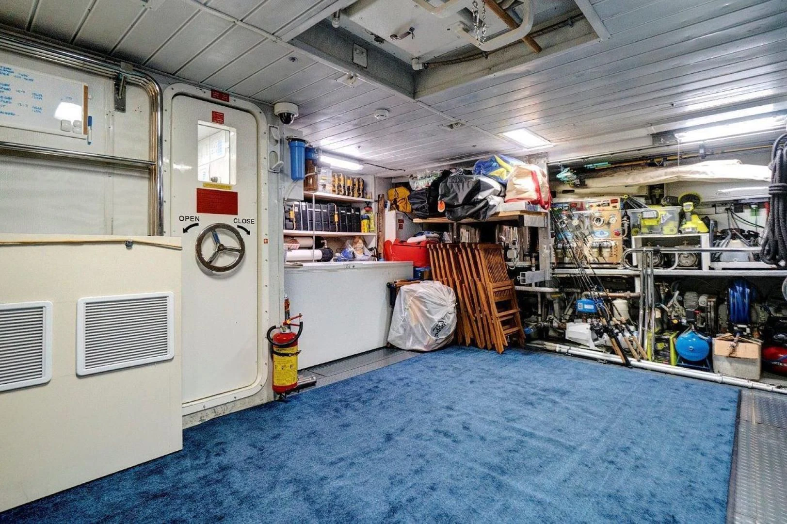 a room with shelves and a fan aboard VIVERE Yacht for Sale