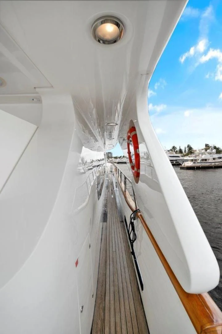 a boat with a red stripe aboard VIVERE Yacht for Sale