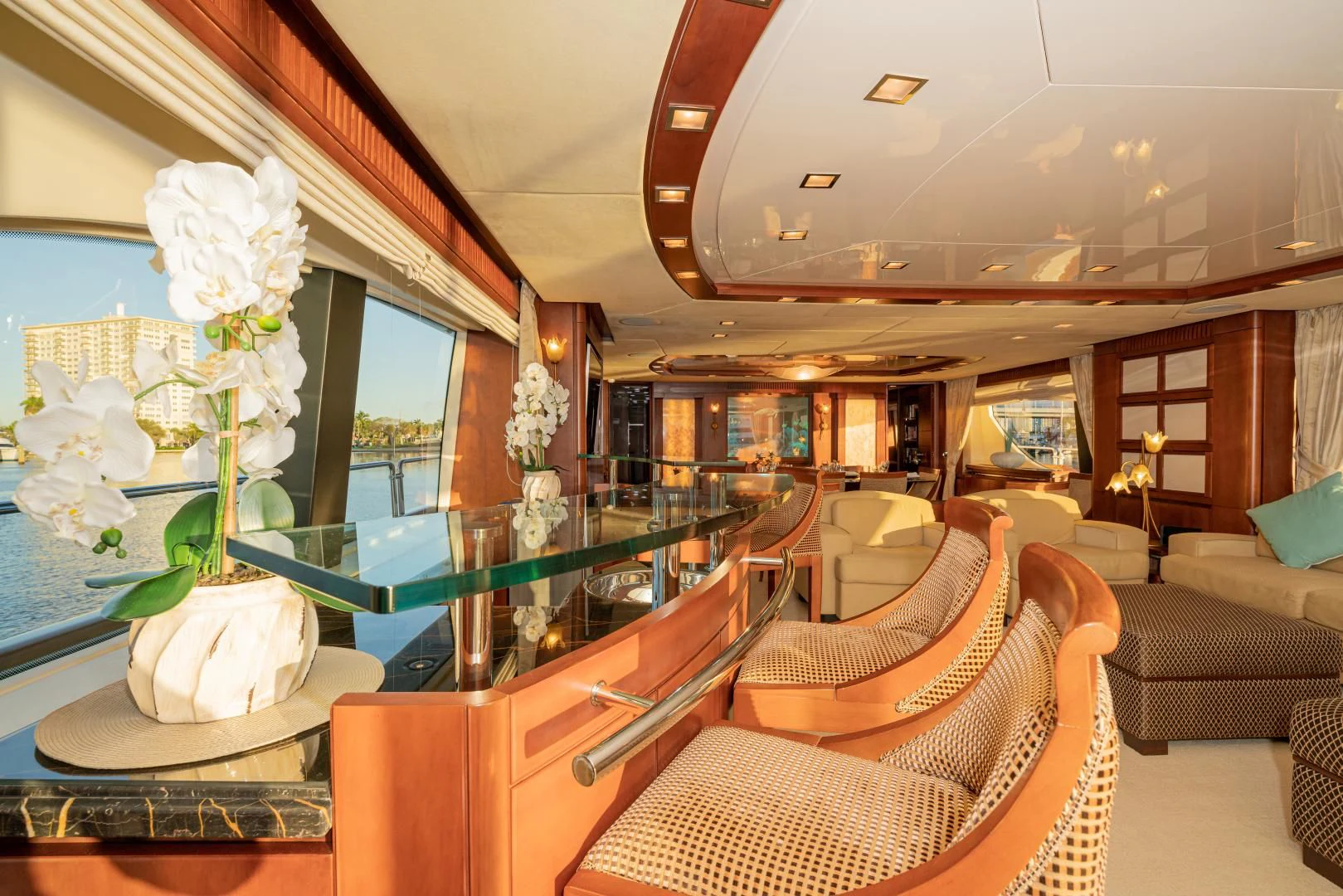 a room with a table chairs and a couch aboard VIVERE Yacht for Sale