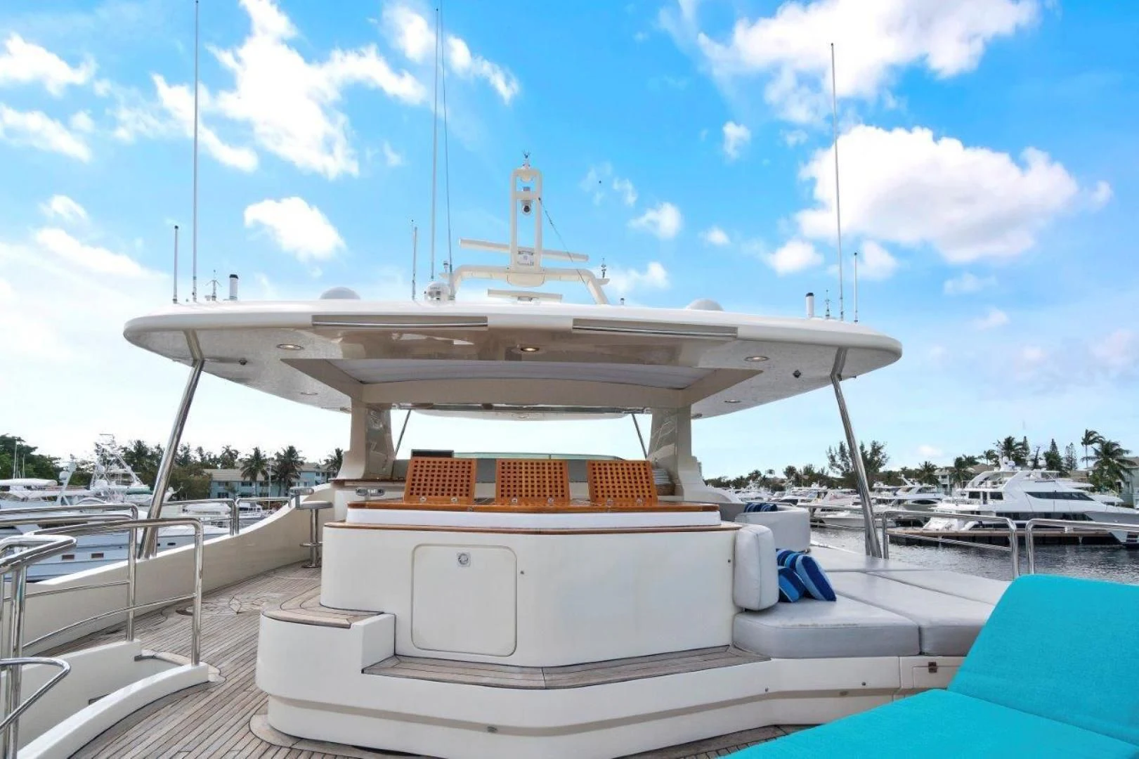 a white boat on a dock aboard VIVERE Yacht for Sale