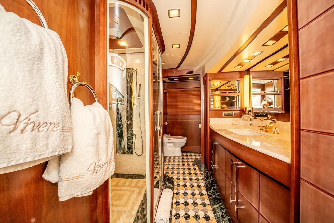 a bathroom with a large mirror aboard VIVERE Yacht for Sale