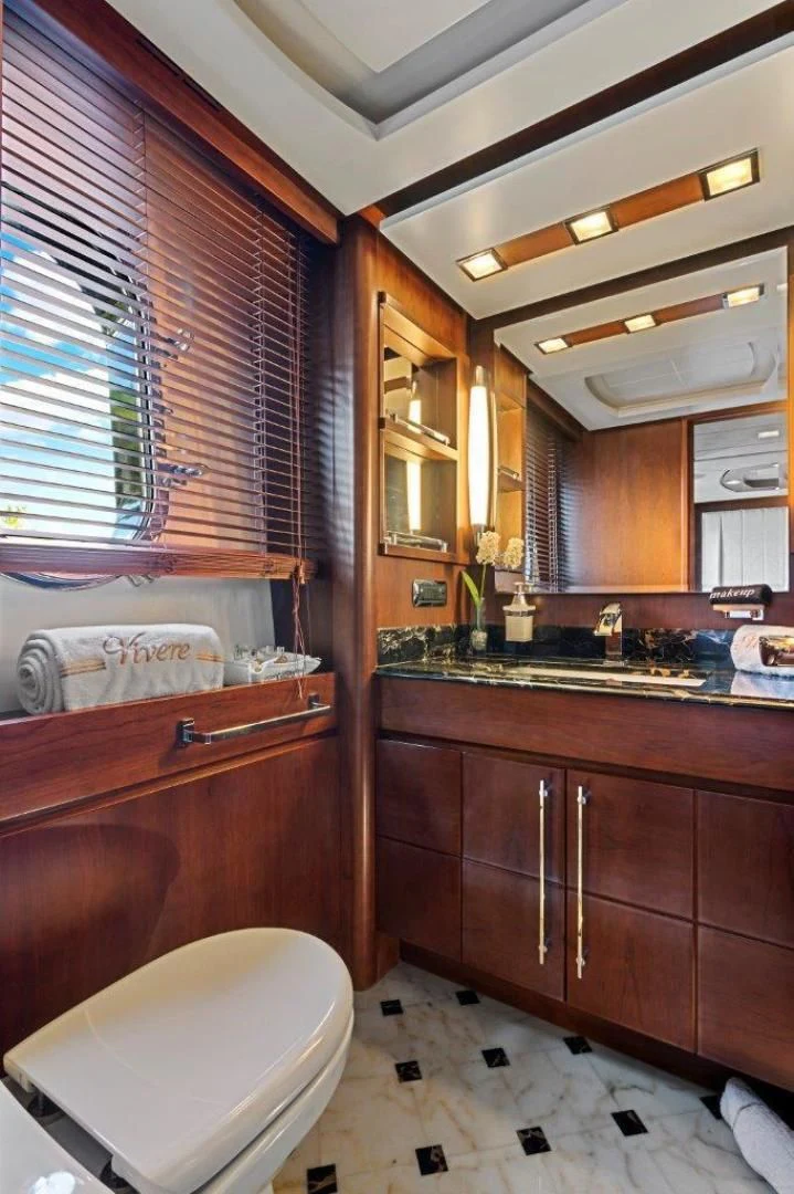 a bathroom with a toilet and sink aboard VIVERE Yacht for Sale