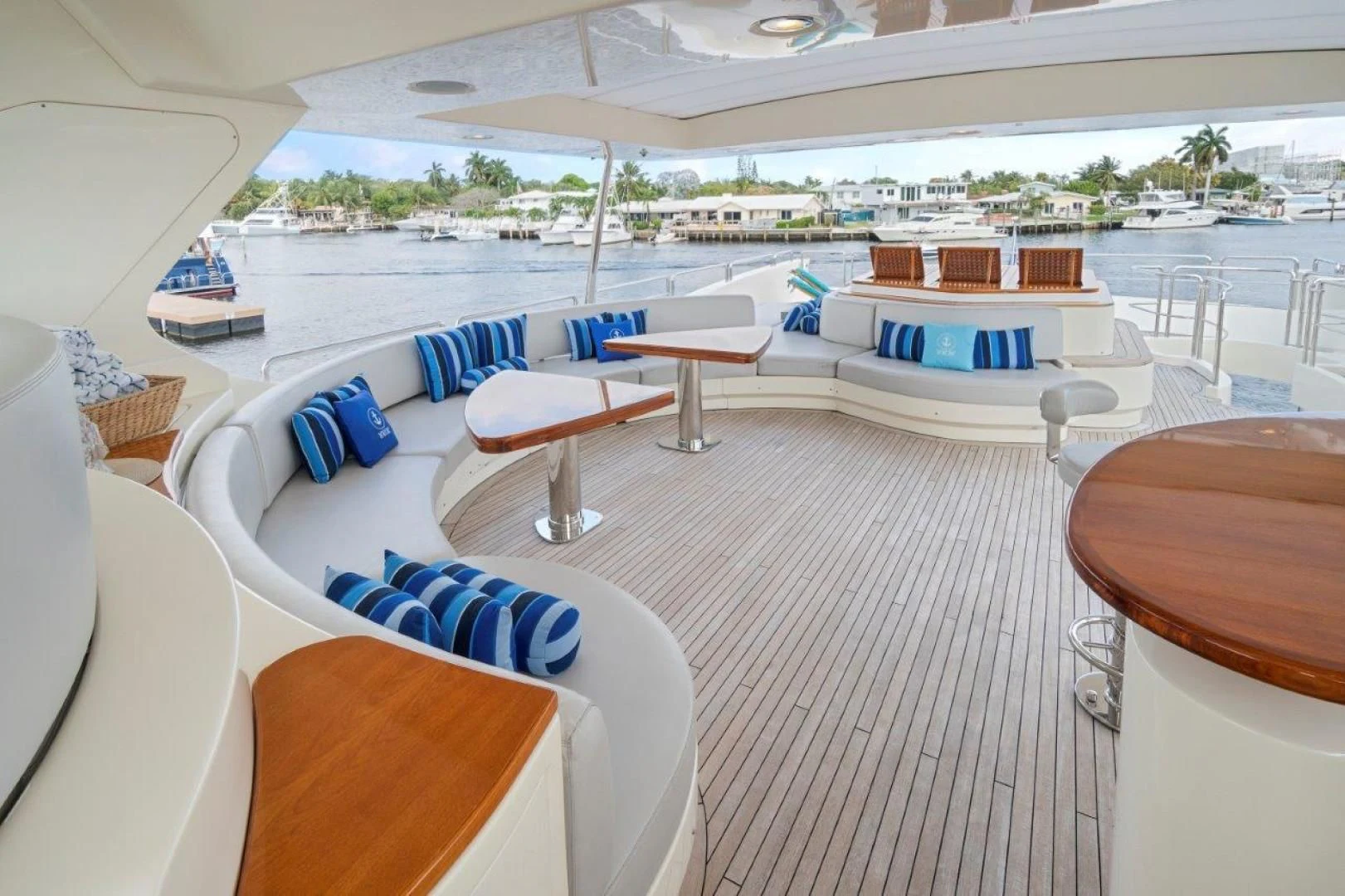 a lounge area with lounge chairs and a pool aboard VIVERE Yacht for Sale