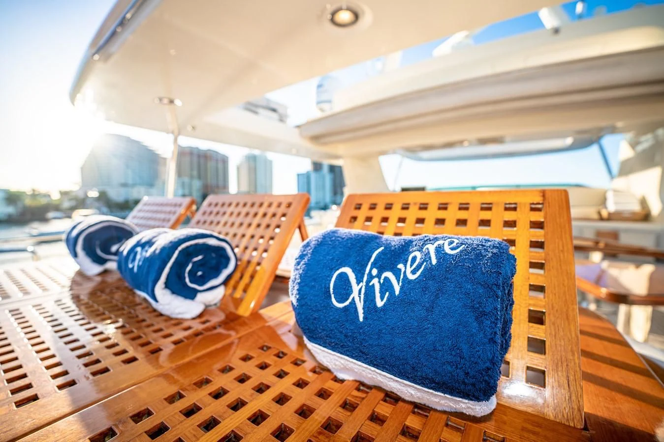 a blue and white ball on a wooden table aboard VIVERE Yacht for Sale