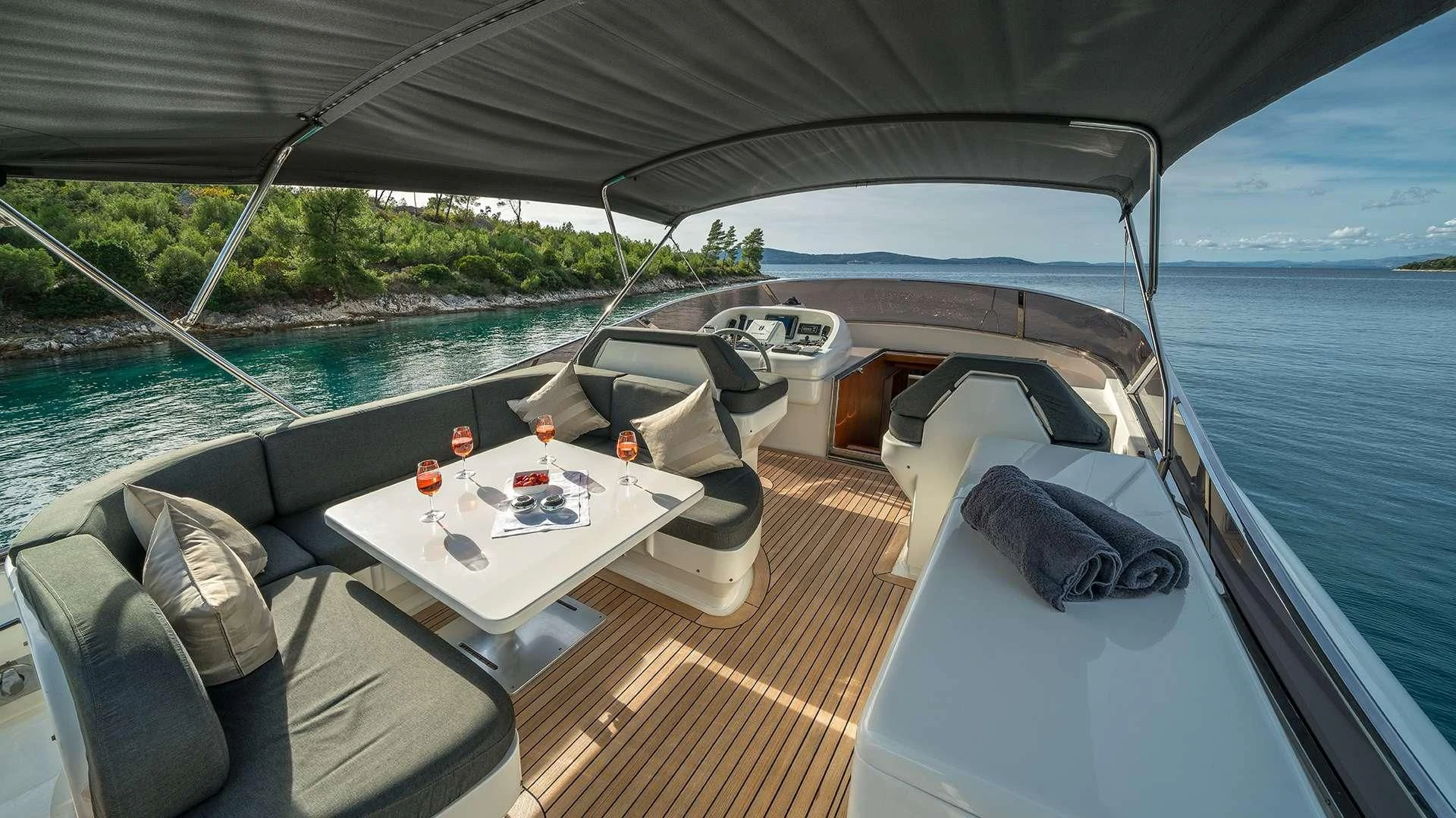 a boat with a table and chairs on it aboard JANTAR Yacht for Charter
