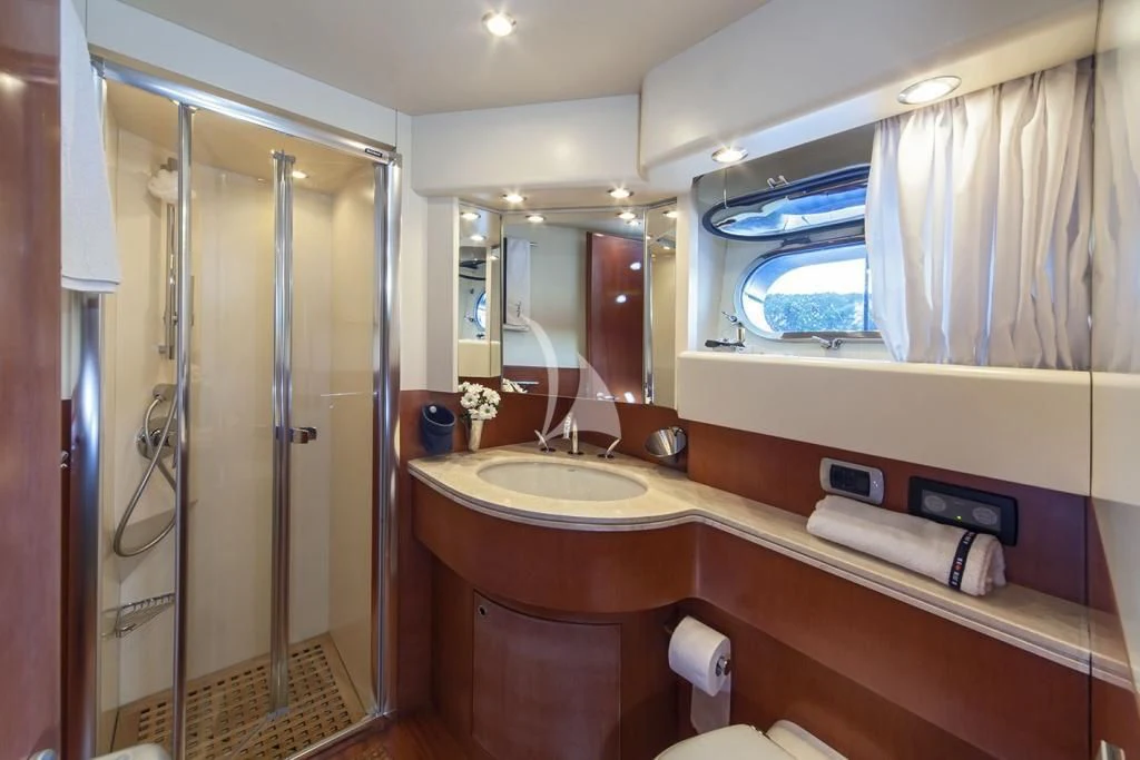 a bathroom with a large mirror aboard JANTAR Yacht for Charter