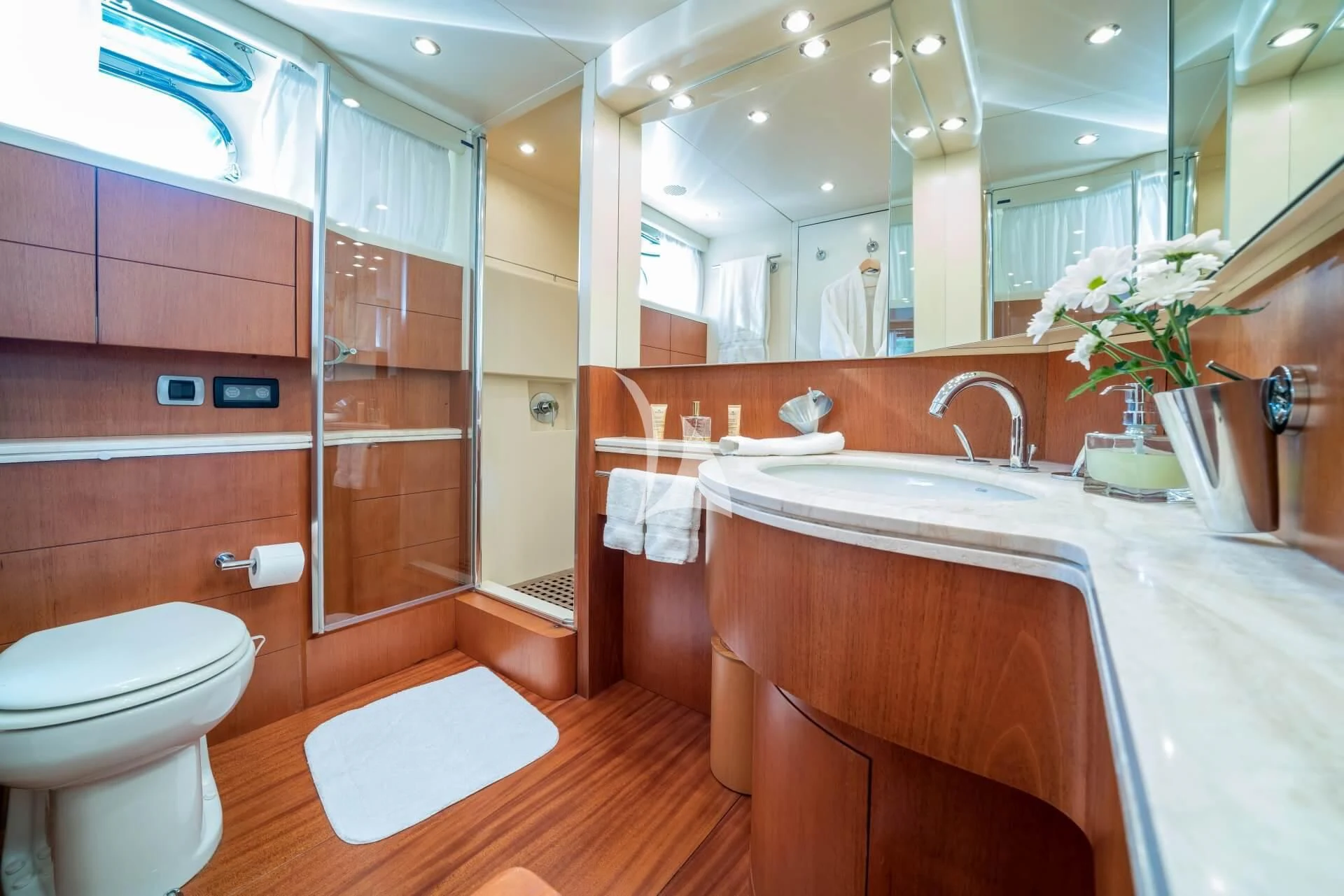 a bathroom with a large mirror aboard JANTAR Yacht for Charter