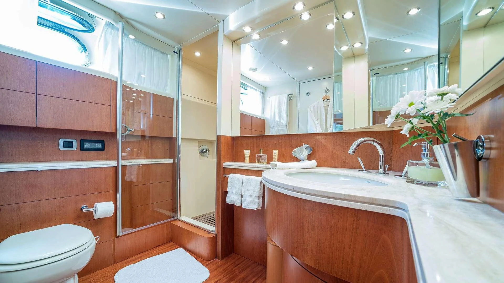 a bathroom with a glass shower aboard JANTAR Yacht for Charter