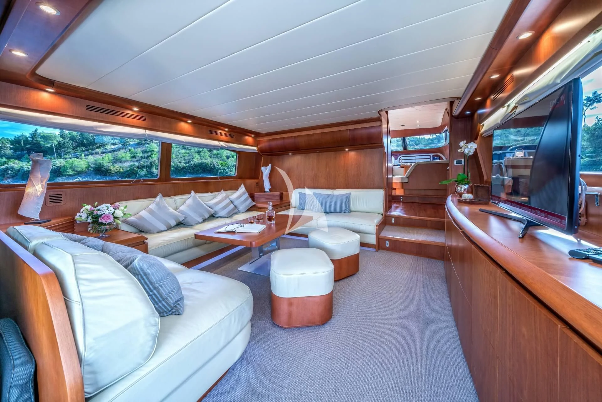 a living room with a couch and a table aboard JANTAR Yacht for Charter