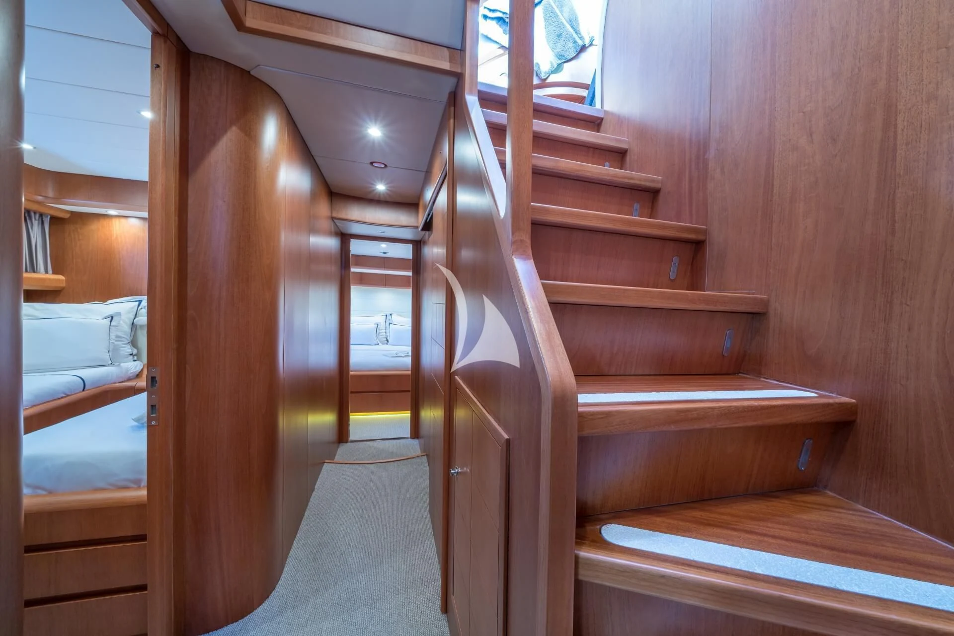 a wooden staircase in a room aboard JANTAR Yacht for Charter