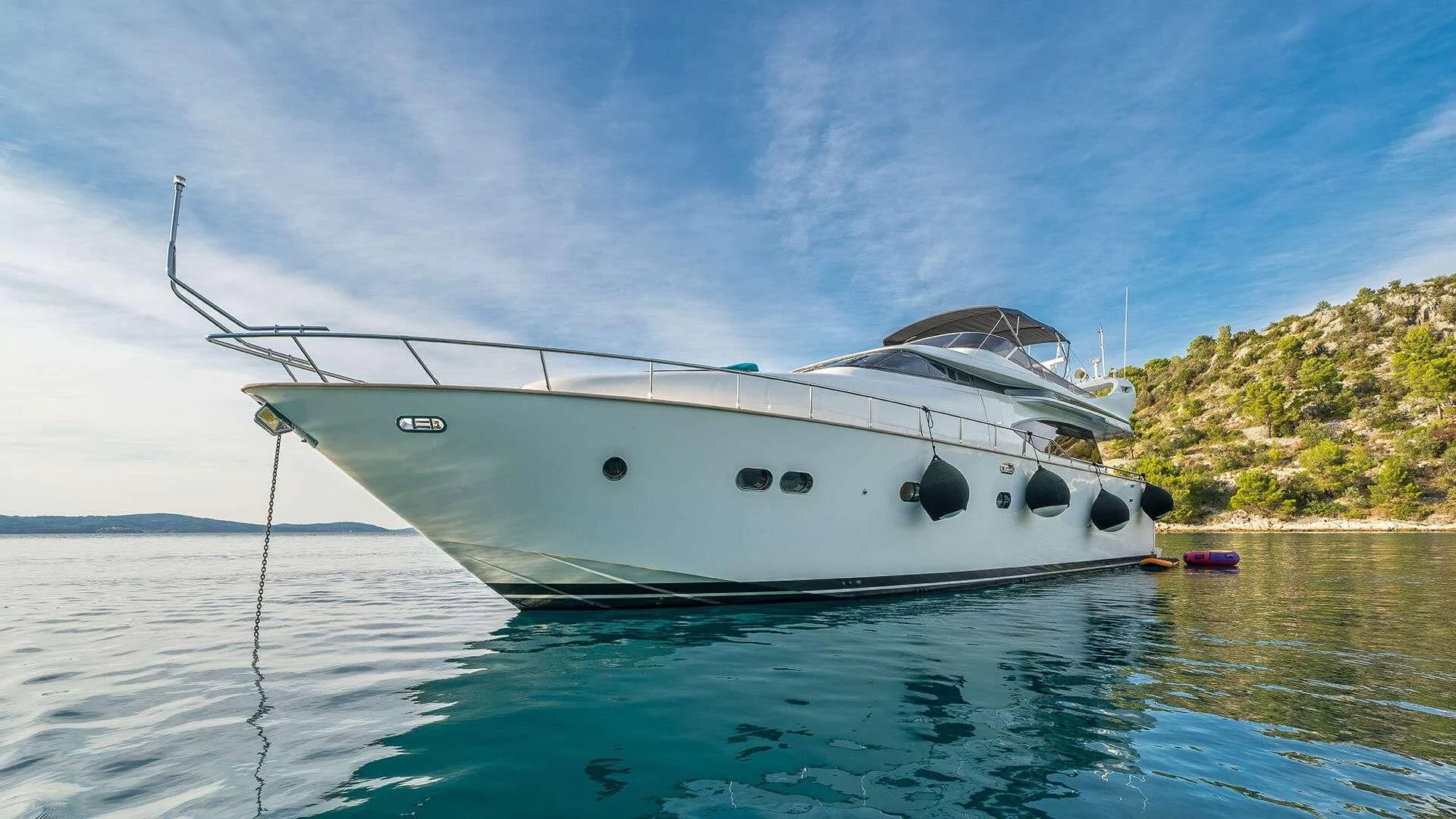 a white boat in the water aboard JANTAR Yacht for Charter